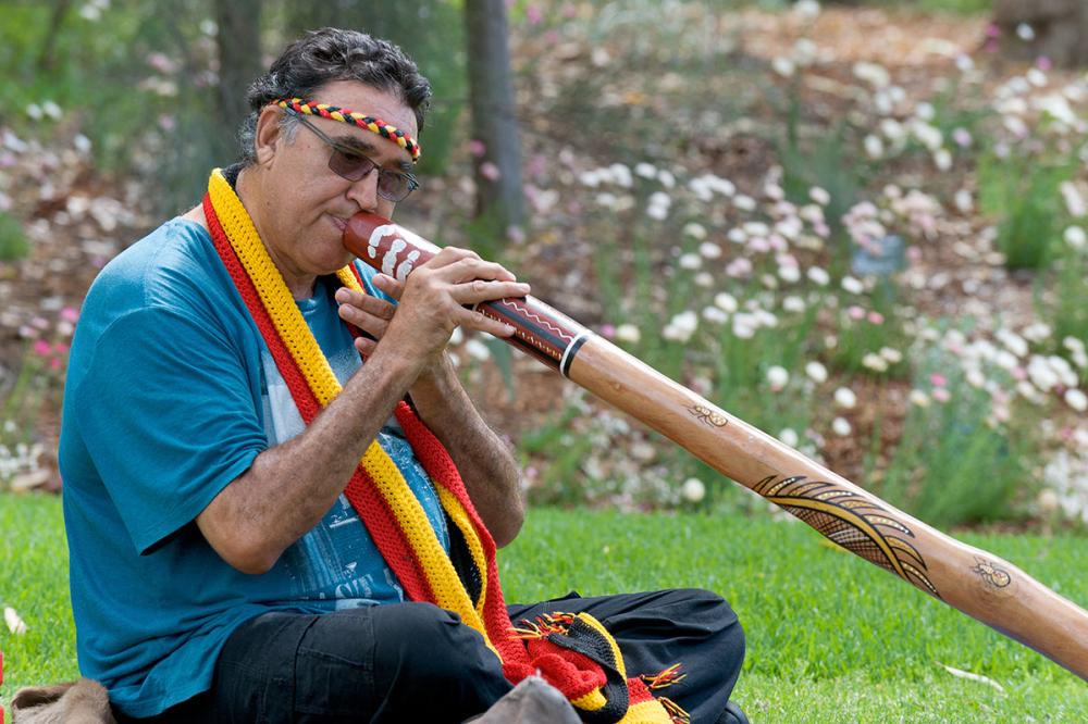 Wadumbah Aboriginal Dance Group's James Webb playing a didgeridoo.