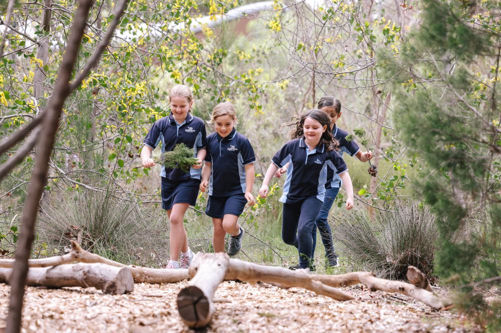 Children running in a natural setting.