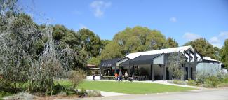 Poolgarla Family Area featuring Koorak Cafe, lawn, playground and plenty of trees.
