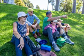 Family sitting on the hill near Fraser Avenue.