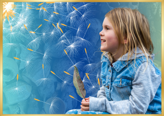 Young girl holding a feather.