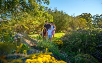 Family at the WA Botanic Garden entrance beds