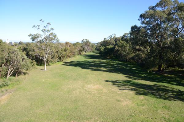 Broadwalk Vista is a long thin expanse of lawn between the DNA tower and May Drive Parkland.