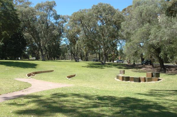 Saw Avenue Amphitheatre is a grassed area with two semicircular stone steps providing seating.